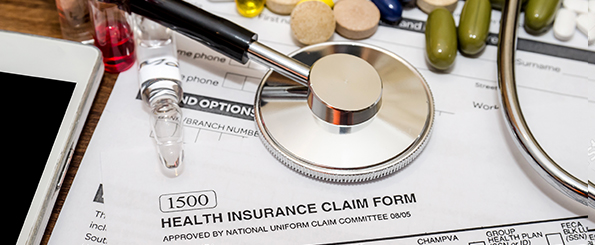 stethoscope and insurance claim form