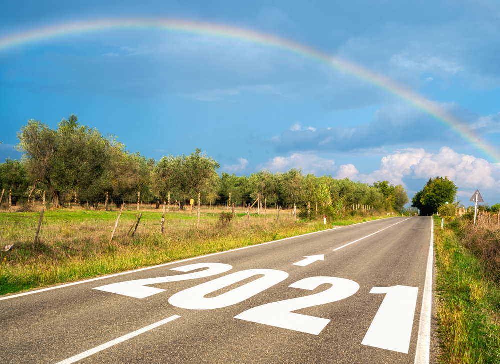 rainbow over a highway with the year 2021 painted, illustrating predictions for Medicare Secondary Payer in 2021